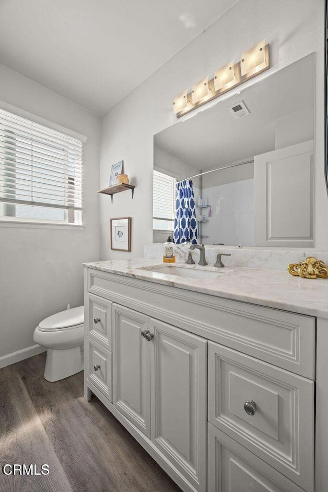 3151 W Hemlock St, Oxnard, CA 93035 - full bath with vanity, a shower with curtain, and wood finished floors