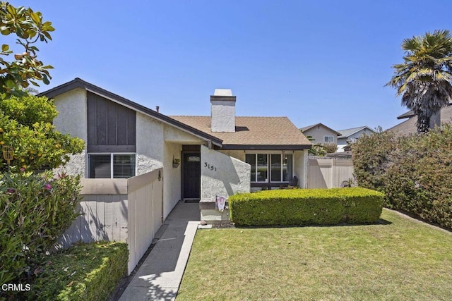 3151 W Hemlock St, Oxnard, CA 93035 - view of front of home with a chimney and stucco siding