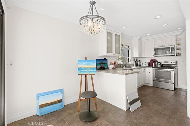 422 Cypress St, Laguna Beach, CA 92651 - kitchen with stainless steel appliances, white cabinetry, a peninsula, glass insert cabinets, and a chandelier