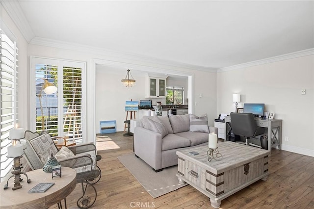 422 Cypress St, Laguna Beach, CA 92651 - living room with wood-type flooring, ornamental molding, healthy amount of natural light, and a desk