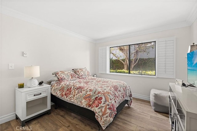 422 Cypress St, Laguna Beach, CA 92651 - bedroom featuring ornamental molding and wood finished floors