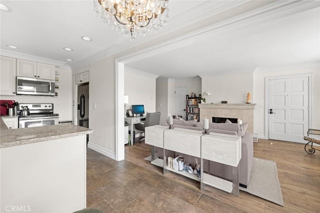 422 Cypress St, Laguna Beach, CA 92651 - living room with ornamental molding, a chandelier, recessed lighting, a fireplace, and a desk