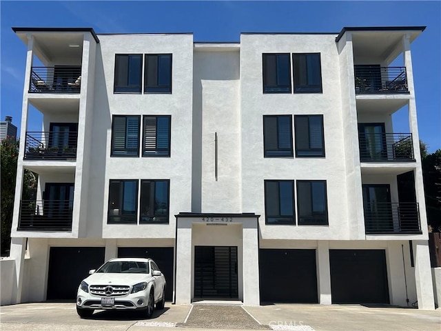 422 Cypress St, Laguna Beach, CA 92651 - view of apartment building / complex with an attached garage and driveway