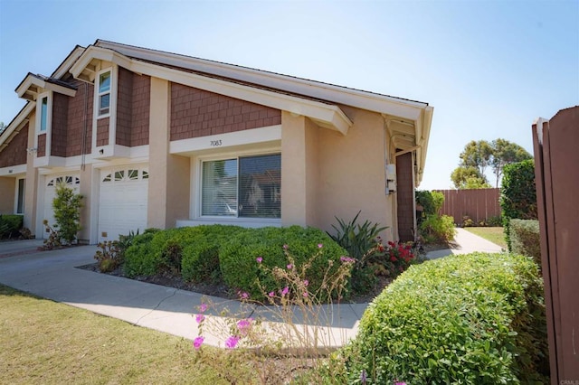 7083 Deerhurst Ct, San Diego, CA 92139 - view of side of property with stucco siding and a garage