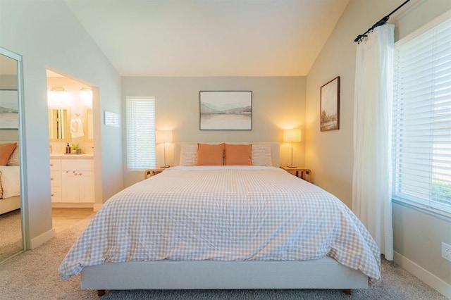 7083 Deerhurst Ct, San Diego, CA 92139 - bedroom featuring vaulted ceiling, light carpet, and connected bathroom