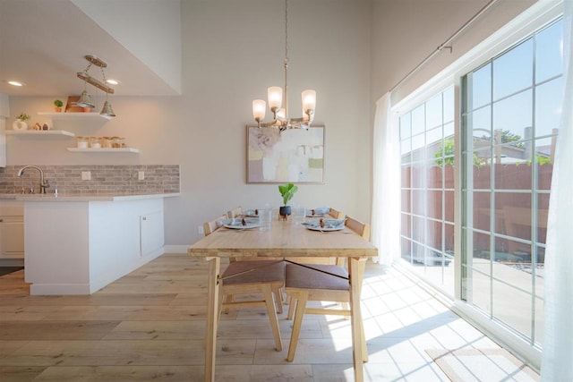 7083 Deerhurst Ct, San Diego, CA 92139 - dining room with light wood-style flooring, a chandelier, and recessed lighting