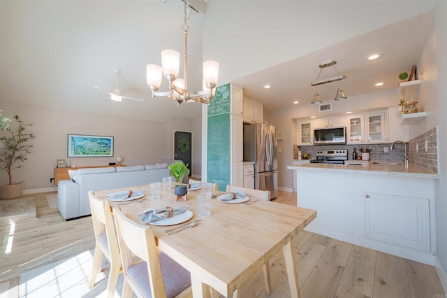 7083 Deerhurst Ct, San Diego, CA 92139 - dining space with a chandelier, light wood-type flooring, recessed lighting, and a ceiling fan
