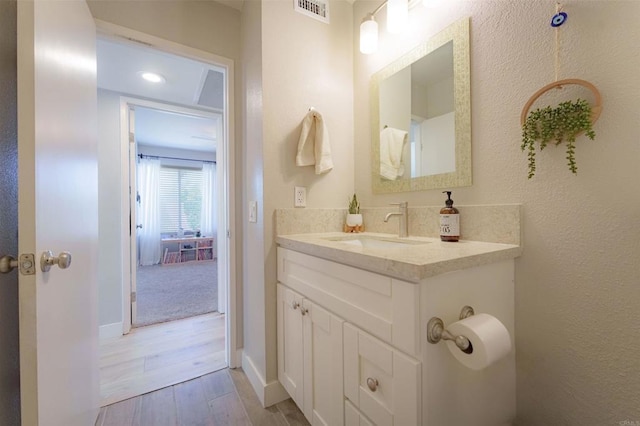 7083 Deerhurst Ct, San Diego, CA 92139 - bathroom featuring vanity and wood finished floors
