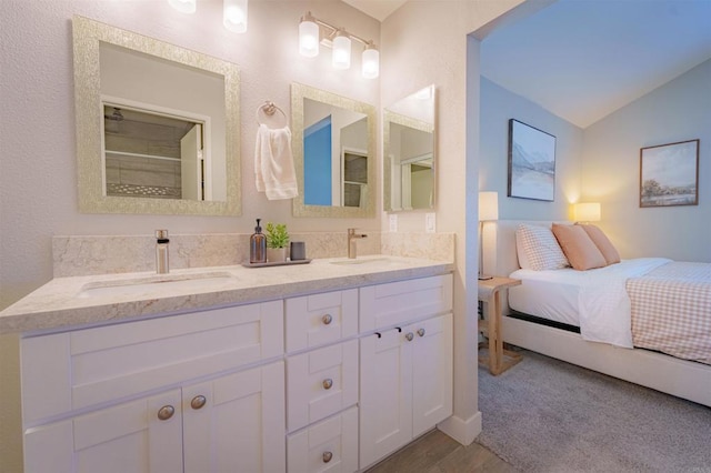 7083 Deerhurst Ct, San Diego, CA 92139 - bathroom with double vanity, lofted ceiling, and wood finished floors