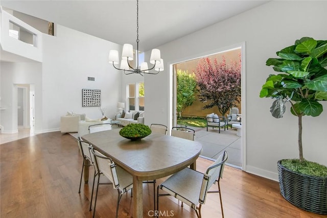 14 Pavona, Newport Coast, CA 92657 - dining space with a chandelier and wood finished floors