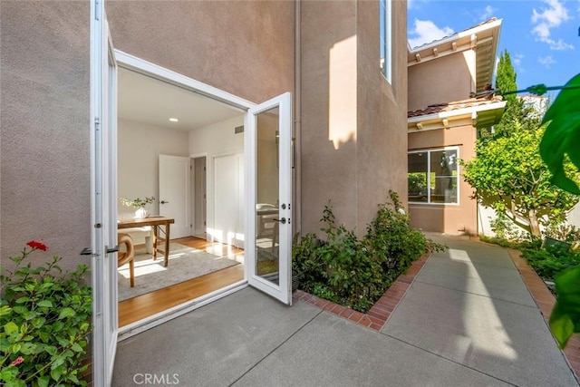 14 Pavona, Newport Coast, CA 92657 - view of exterior entry featuring stucco siding and a patio area