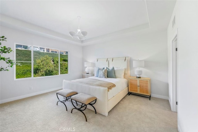 14 Pavona, Newport Coast, CA 92657 - bedroom with a tray ceiling, a chandelier, and light colored carpet
