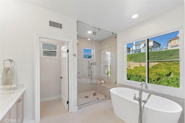 14 Pavona, Newport Coast, CA 92657 - full bath featuring a stall shower, a freestanding bath, plenty of natural light, vanity, and recessed lighting