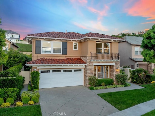 14 Pavona, Newport Coast, CA 92657 - mediterranean / spanish-style house with a balcony, driveway, an attached garage, a tile roof, and stucco siding