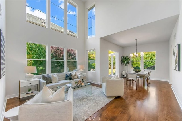 14 Pavona, Newport Coast, CA 92657 - living area featuring a chandelier, wood finished floors, and a high ceiling