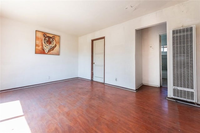 1132 E 65th St, Los Angeles, CA 90001 - unfurnished room with a heating unit and wood finished floors