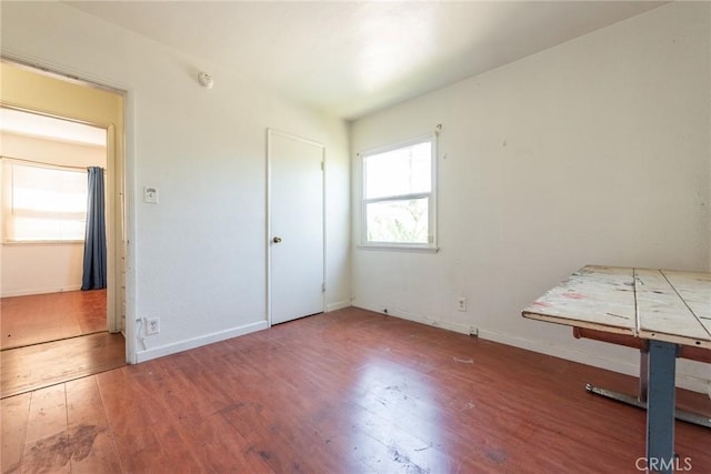 1132 E 65th St, Los Angeles, CA 90001 - unfurnished bedroom featuring wood-type flooring and baseboards
