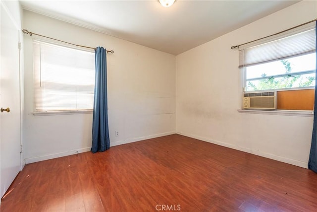 1132 E 65th St, Los Angeles, CA 90001 - spare room with wood finished floors and cooling unit