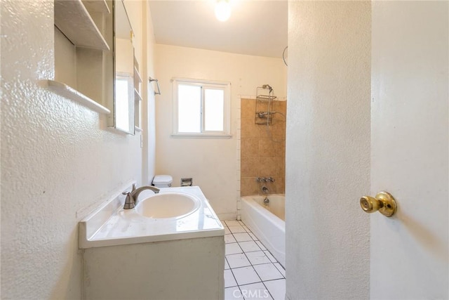 1132 E 65th St, Los Angeles, CA 90001 - full bath with a textured wall, vanity, tile patterned flooring, and shower / washtub combination