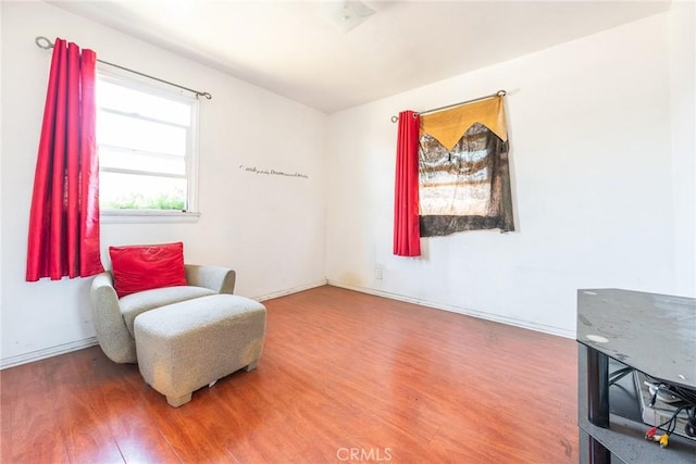 1132 E 65th St, Los Angeles, CA 90001 - living area featuring wood finished floors and baseboards