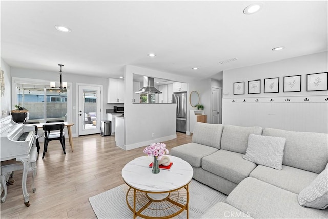 330 Glenshaw Dr, La Puente, CA 91744 - living room with light wood finished floors, recessed lighting, and a chandelier