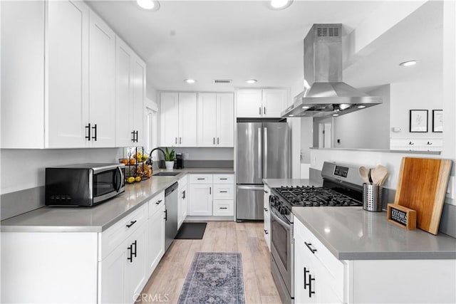 330 Glenshaw Dr, La Puente, CA 91744 - kitchen featuring stainless steel appliances, range hood, recessed lighting, and white cabinets