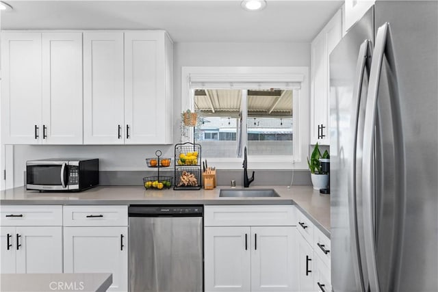 330 Glenshaw Dr, La Puente, CA 91744 - kitchen featuring appliances with stainless steel finishes, white cabinets, light countertops, and recessed lighting