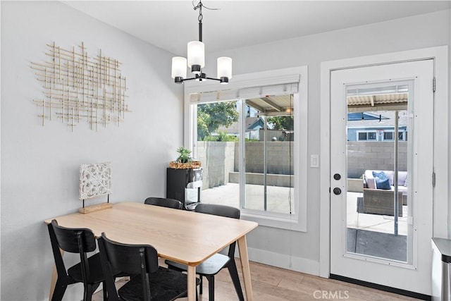 330 Glenshaw Dr, La Puente, CA 91744 - dining area featuring a chandelier and light wood-type flooring