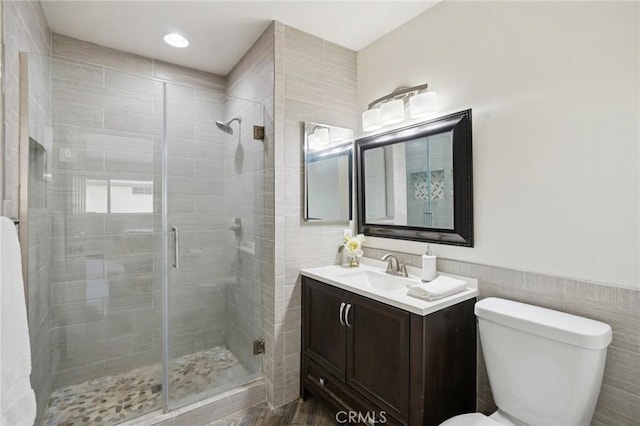 1846 Rosebrook Ln, Rosemead, CA 91770 - bathroom featuring vanity, a shower stall, and tile walls