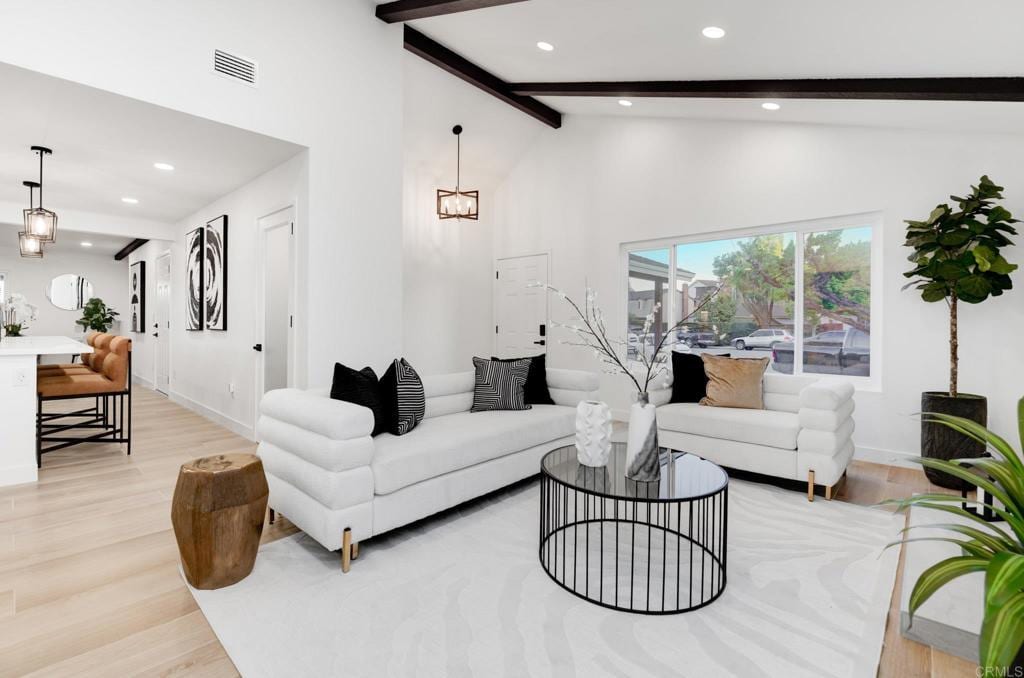 1255 Pecan Pl, Chula Vista, CA 91911 - living area with beamed ceiling, light wood-style floors, recessed lighting, and high vaulted ceiling