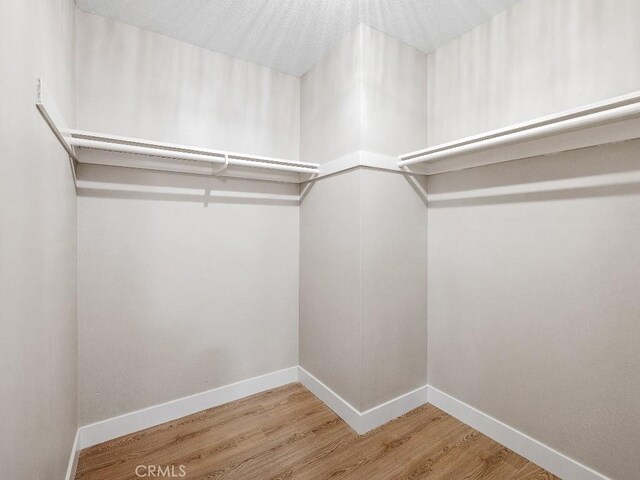 971 N Clifford Ave, Rialto, CA 92376 - spacious closet featuring wood finished floors