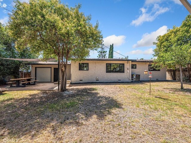 971 N Clifford Ave, Rialto, CA 92376 - view of front of house with crawl space, a garage, and stucco siding