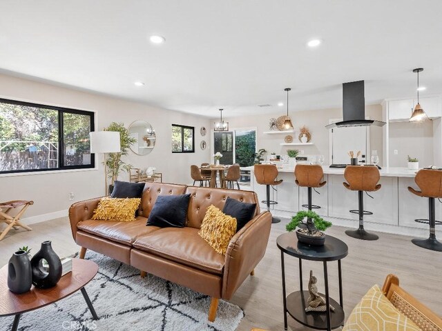 971 N Clifford Ave, Rialto, CA 92376 - living area with healthy amount of natural light, recessed lighting, and light wood-style flooring
