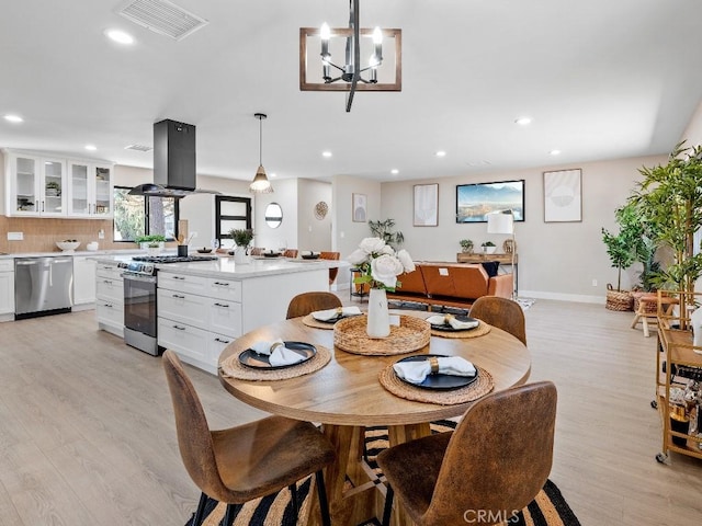 971 N Clifford Ave, Rialto, CA 92376 - dining area featuring light wood-type flooring, recessed lighting, and a chandelier