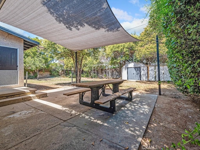 971 N Clifford Ave, Rialto, CA 92376 - view of patio / terrace with a storage shed and outdoor dining area