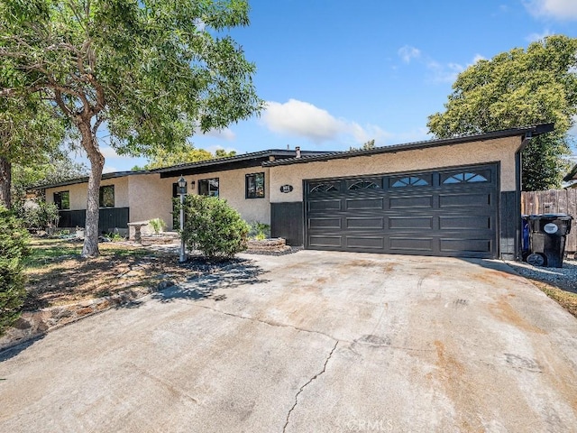 971 N Clifford Ave, Rialto, CA 92376 - single story home featuring concrete driveway, a garage, and stucco siding