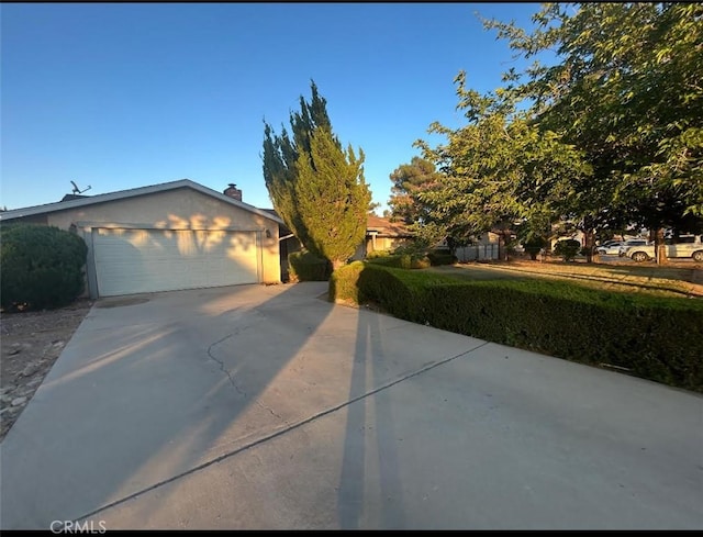 7427 Oxford Ave, Hesperia, CA 92345 - view of front of property featuring a garage and concrete driveway