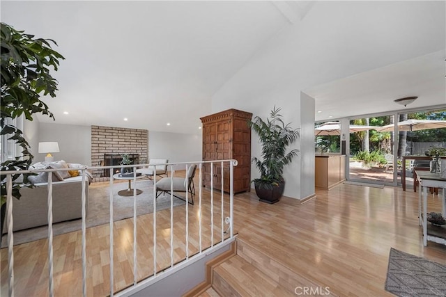 26301 Montarez Cir, Mission Viejo, CA 92691 - living room featuring a fireplace, wood finished floors, and vaulted ceiling