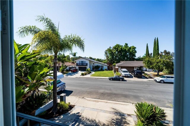 26301 Montarez Cir, Mission Viejo, CA 92691 - view of asphalt road featuring a residential view and sidewalks
