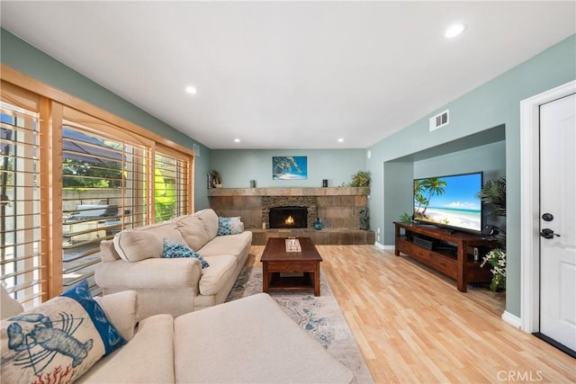 26301 Montarez Cir, Mission Viejo, CA 92691 - living room featuring wood finished floors, recessed lighting, and a stone fireplace