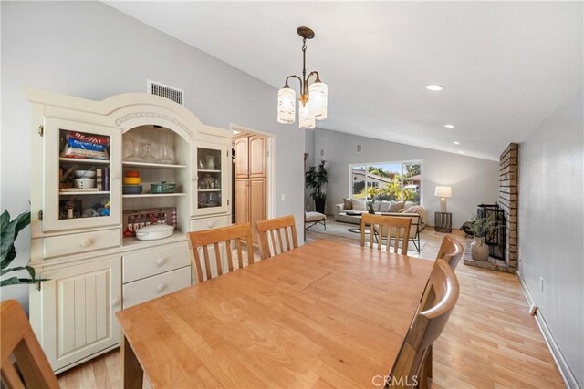 26301 Montarez Cir, Mission Viejo, CA 92691 - dining area featuring vaulted ceiling, a chandelier, light wood-style flooring, and recessed lighting