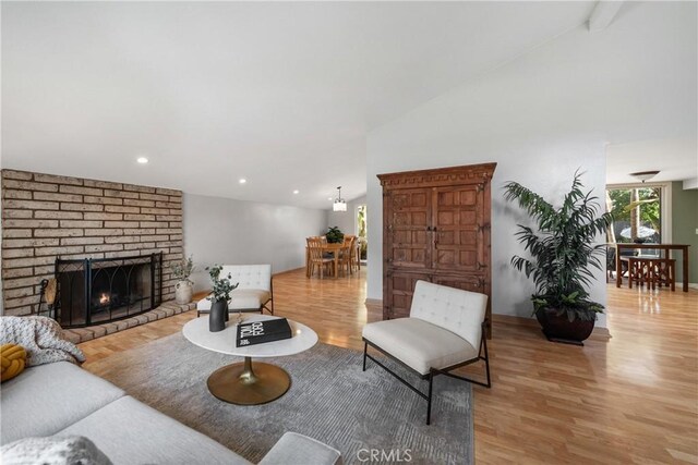 26301 Montarez Cir, Mission Viejo, CA 92691 - living room featuring light wood-type flooring, a fireplace, recessed lighting, and lofted ceiling