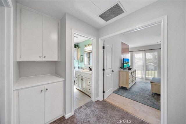 26301 Montarez Cir, Mission Viejo, CA 92691 - hallway featuring light colored carpet and light tile patterned flooring