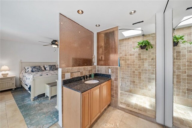 26301 Montarez Cir, Mission Viejo, CA 92691 - bathroom with walk in shower, vanity, tile walls, tile patterned floors, and ensuite bathroom