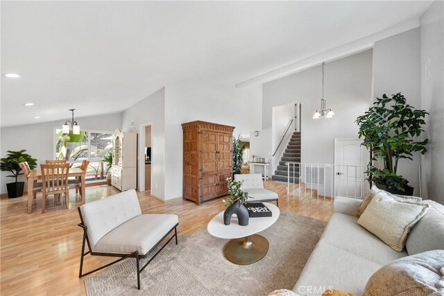 26301 Montarez Cir, Mission Viejo, CA 92691 - living area featuring lofted ceiling, stairs, a chandelier, light wood-style flooring, and recessed lighting
