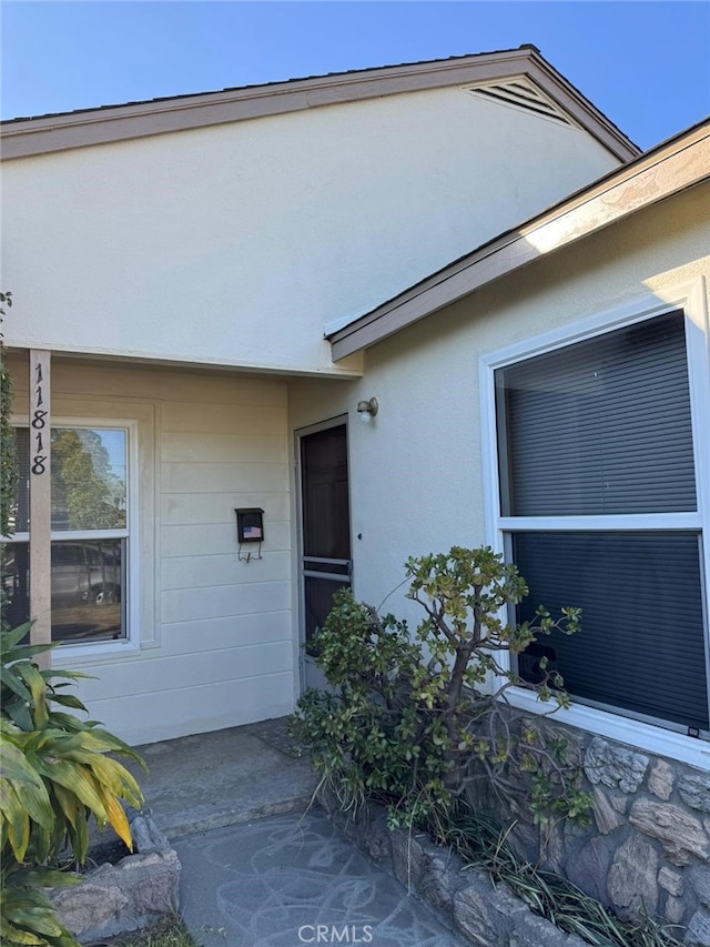 11818 Graystone, Norwalk, CA 90650 - view of exterior entry featuring stucco siding