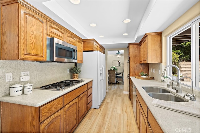 33262 Paseo Molinos, San Juan Capistrano, CA 92675 - kitchen featuring appliances with stainless steel finishes, light wood-style floors, recessed lighting, tasteful backsplash, and ceiling fan