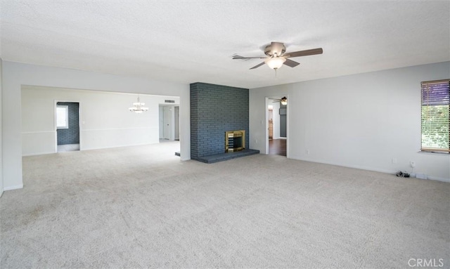 26409 Brandywine Ct, Menifee, CA 92586 - unfurnished living room with a ceiling fan, a chandelier, carpet flooring, and plenty of natural light