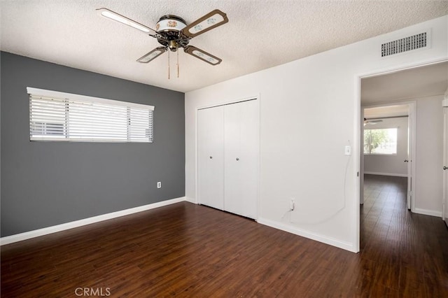 26409 Brandywine Ct, Menifee, CA 92586 - unfurnished bedroom with wood finished floors, a textured ceiling, a closet, and a ceiling fan