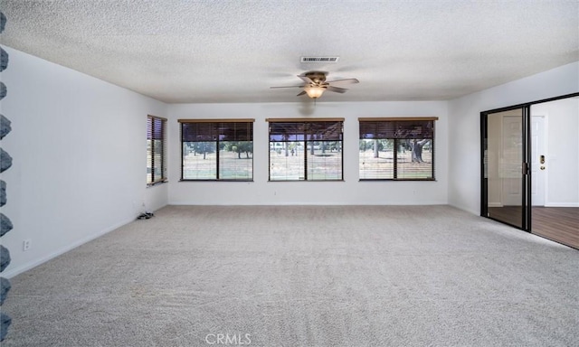 26409 Brandywine Ct, Menifee, CA 92586 - spare room featuring carpet floors, ceiling fan, and a textured ceiling